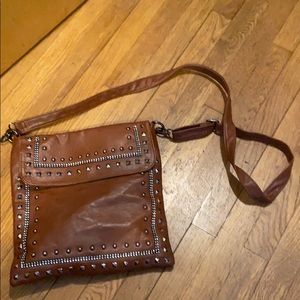 Studded cross body purse.